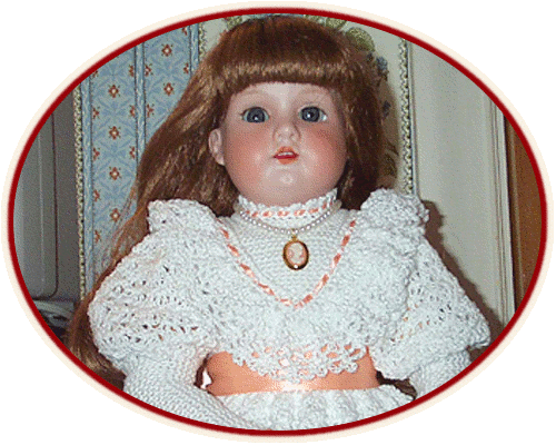 Antique doll in hand-crocheted dress