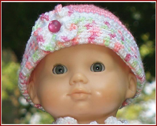 This hat fits a 15 inch baby doll, an 18 inch little girl doll, or if worked with a larger yarn and hook, an infant.